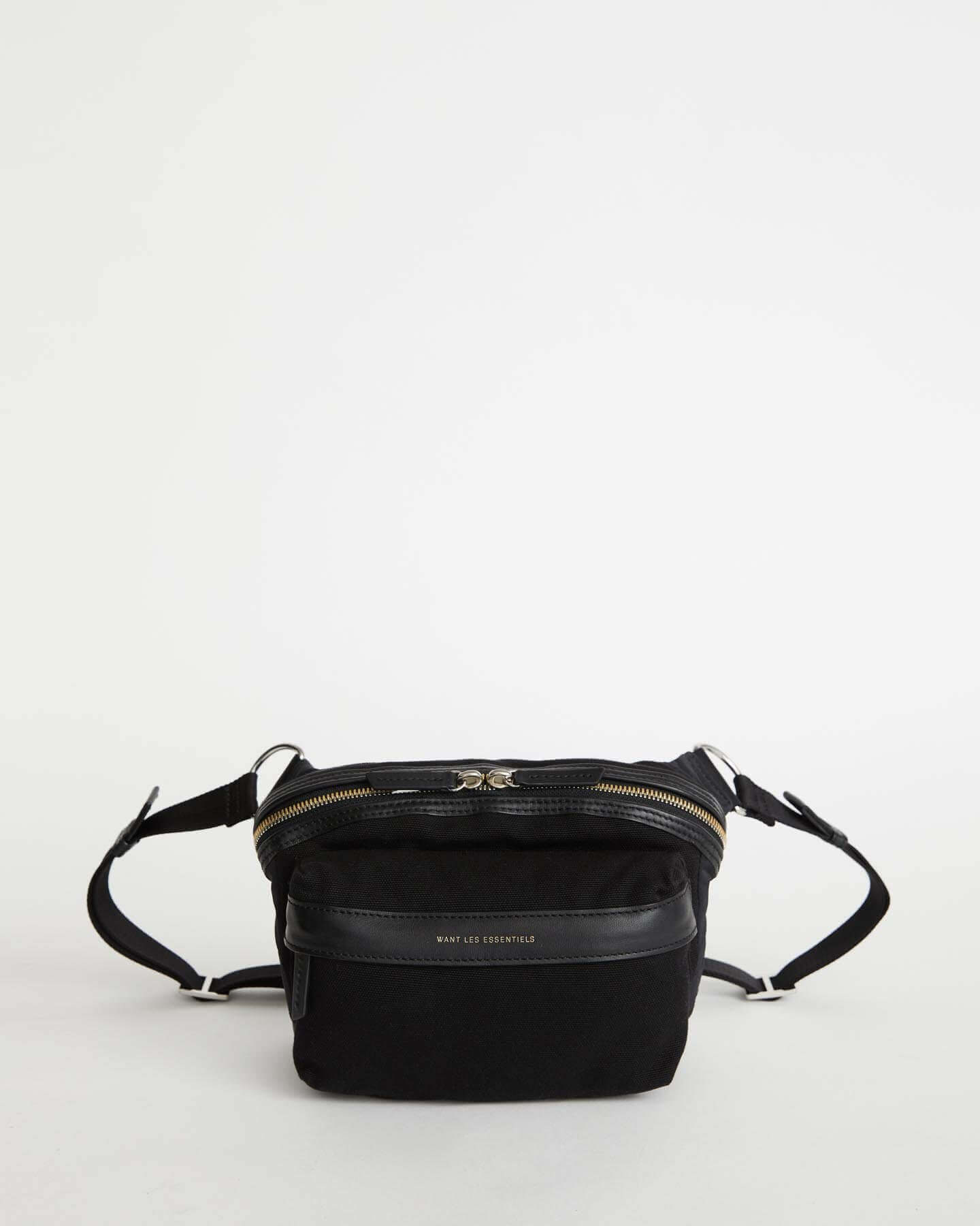 Everyone * needs a little black handbag. The Sela Pouch gives the